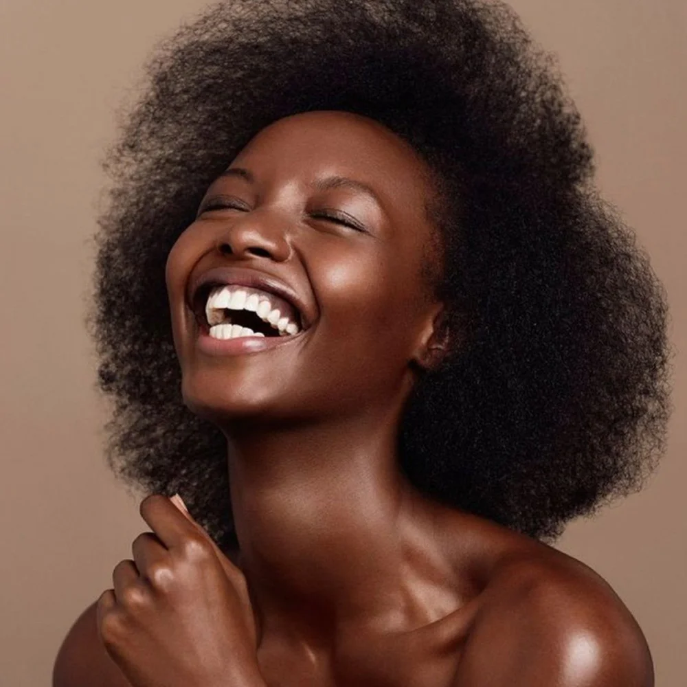 Bright confident smile after teeth whitening at Beam Confident in Arlington, VA